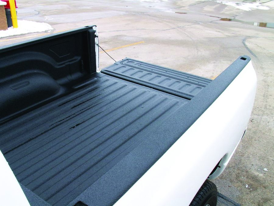 Flak Jacket black spray-on polyurea bed liner applied to a pickup truck bed