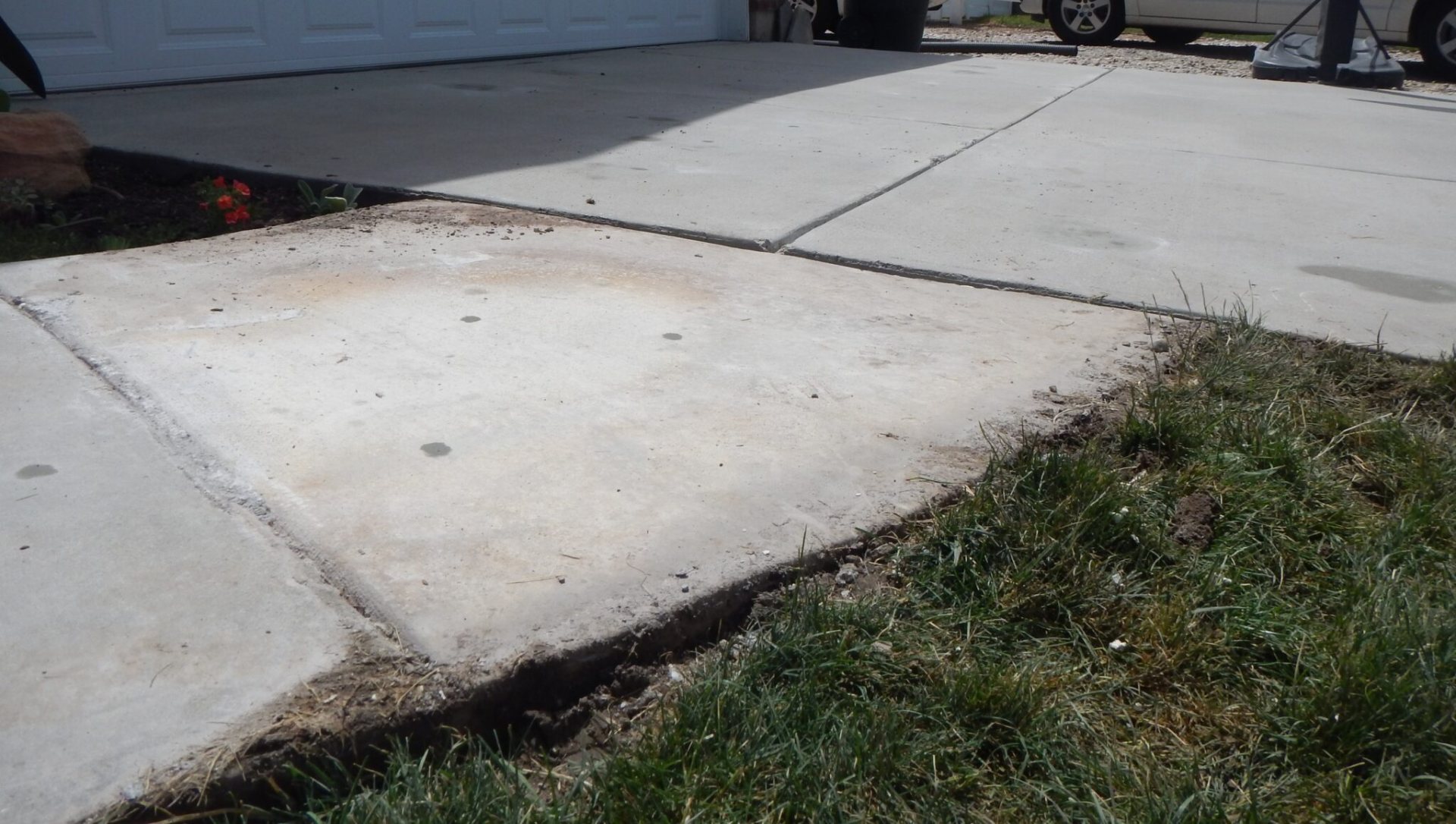 Concrete driveway after polyurethane foam lifting — fully leveled and flush